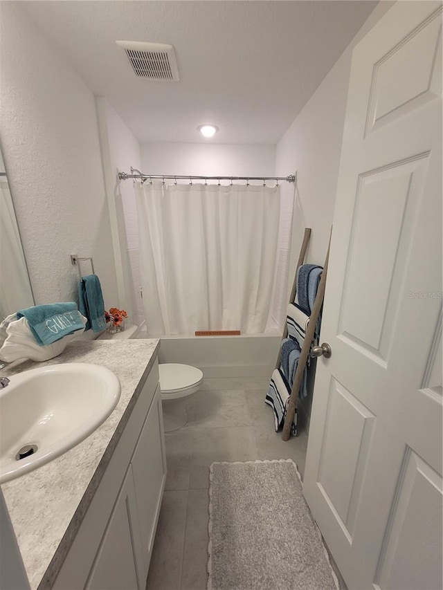 7168 Rison St, Port Charlotte, FL 33981 - full bath with vanity, shower / tub combo with curtain, and tile patterned floors