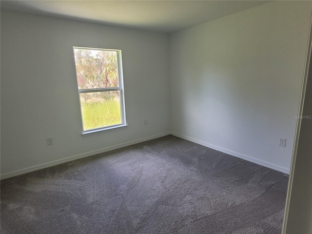 7168 Rison St, Port Charlotte, FL 33981 - unfurnished room featuring dark carpet and baseboards