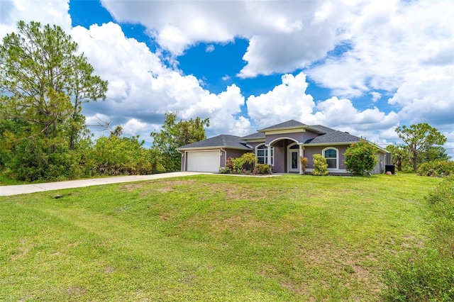 7376 Stetson Ln, Port Charlotte, FL 33981 - view of front of home with driveway, an attached garage, a front yard, and stucco siding