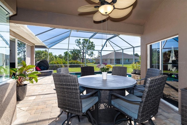 7376 Stetson Ln, Port Charlotte, FL 33981 - view of patio featuring ceiling fan, outdoor dining area, and glass enclosure