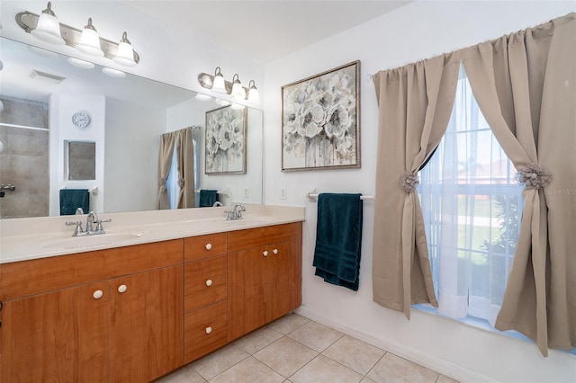 7376 Stetson Ln, Port Charlotte, FL 33981 - full bath featuring double vanity, tile patterned floors, and a tile shower