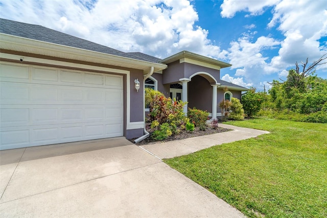 7376 Stetson Ln, Port Charlotte, FL 33981 - view of front of house with concrete driveway, stucco siding, a front yard, and a garage