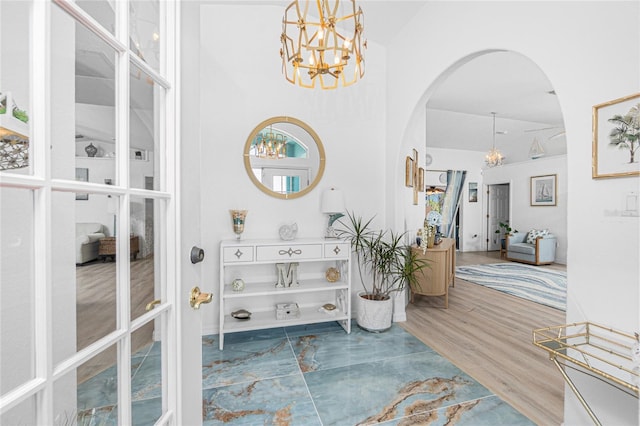 926 Boundary Blvd, Rotonda West, FL 33947 - corridor with arched walkways, a chandelier, and lofted ceiling