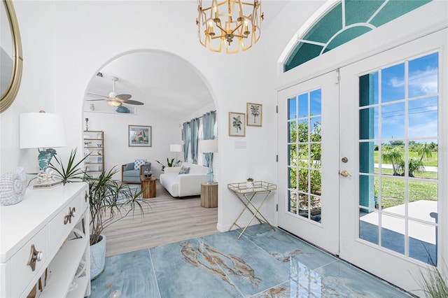 926 Boundary Blvd, Rotonda West, FL 33947 - entryway featuring ceiling fan, arched walkways, a chandelier, french doors, and lofted ceiling