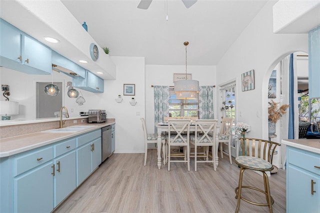 926 Boundary Blvd, Rotonda West, FL 33947 - kitchen with dishwasher, blue cabinets, plenty of natural light, light wood-style floors, and recessed lighting