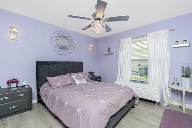 926 Boundary Blvd, Rotonda West, FL 33947 - bedroom with wood finished floors and ceiling fan