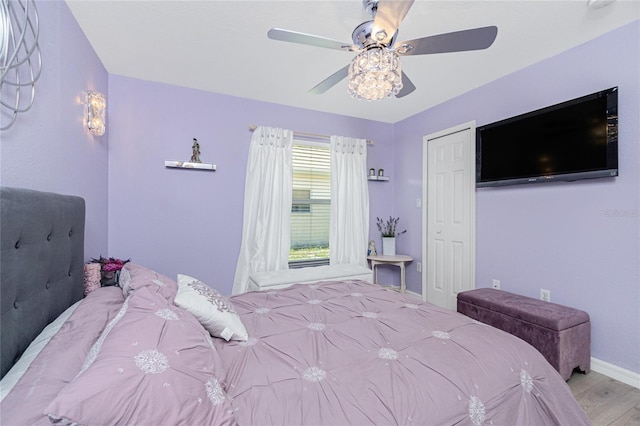 926 Boundary Blvd, Rotonda West, FL 33947 - bedroom with wood finished floors and a ceiling fan