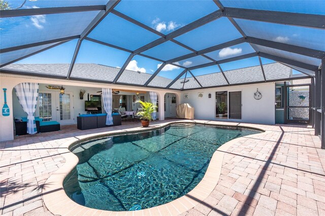 926 Boundary Blvd, Rotonda West, FL 33947 - swimming pool featuring french doors, a patio area, ceiling fan, an outdoor living space, and a lanai