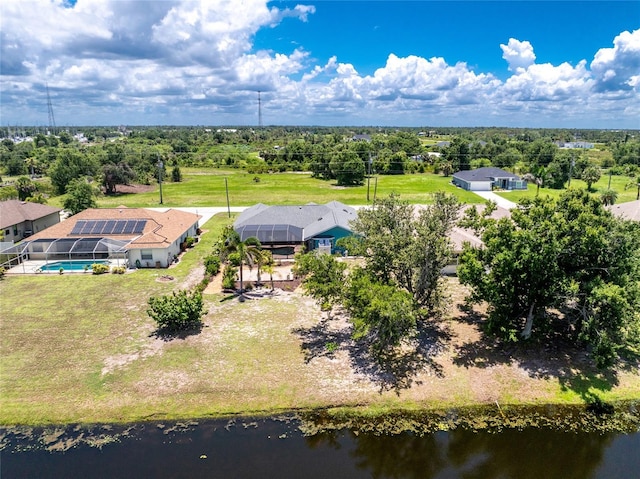 926 Boundary Blvd, Rotonda West, FL 33947 - view of subject property with a pool and a tree filled landscape