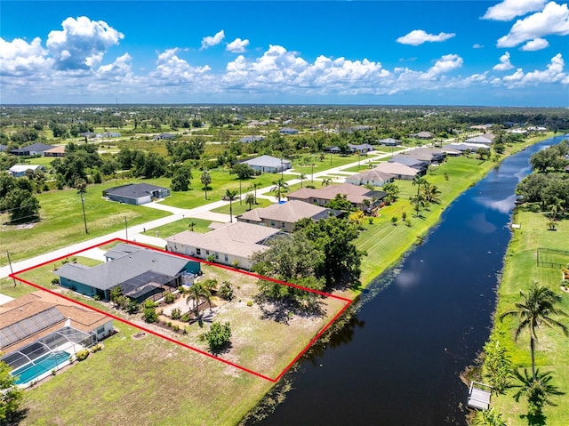 926 Boundary Blvd, Rotonda West, FL 33947 - aerial view of residential area featuring a nearby body of water and property parcel outlined