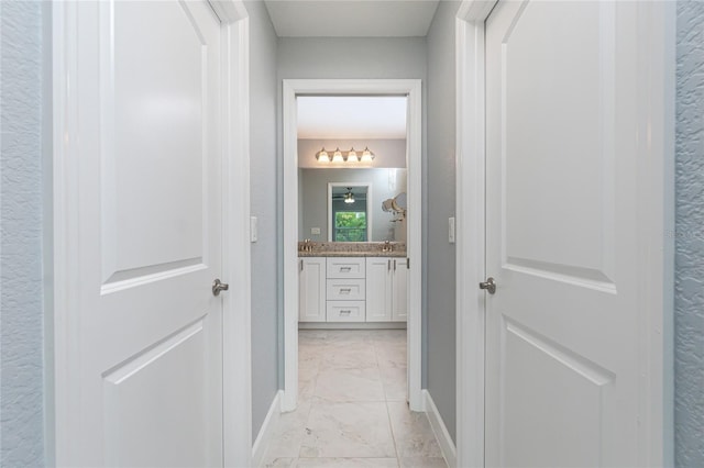 6 Medalist Ct, Rotonda West, FL 33947 - hallway with light marble finish floors and baseboards