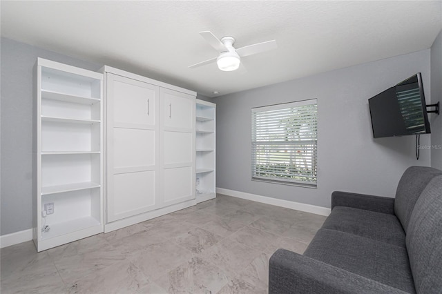 6 Medalist Ct, Rotonda West, FL 33947 - sitting room featuring baseboards and ceiling fan