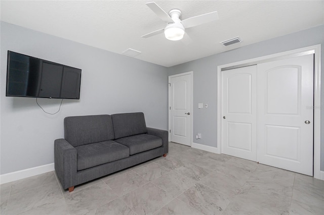 6 Medalist Ct, Rotonda West, FL 33947 - sitting room featuring ceiling fan and baseboards