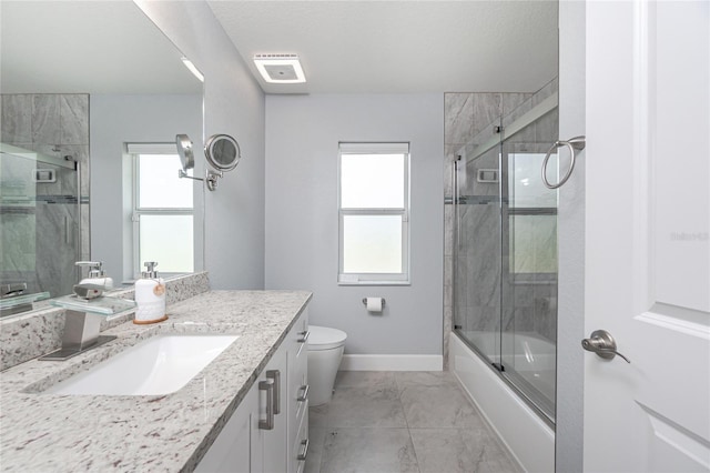 6 Medalist Ct, Rotonda West, FL 33947 - full bath featuring vanity, marble look tiles, and bath / shower combo with glass door