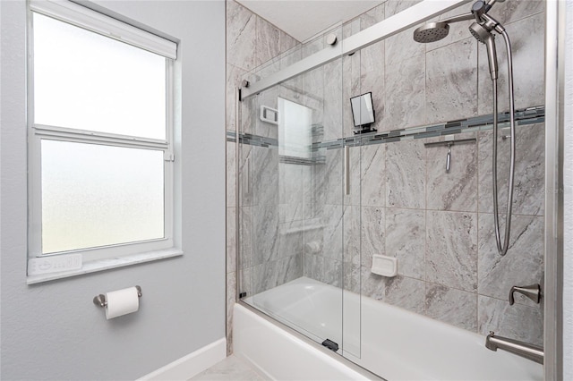 6 Medalist Ct, Rotonda West, FL 33947 - full bath with bath / shower combo with glass door and marble look tile flooring