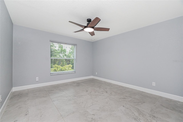 6 Medalist Ct, Rotonda West, FL 33947 - empty room featuring ceiling fan and light marble finish flooring