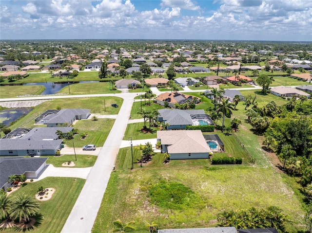 6 Medalist Ct, Rotonda West, FL 33947 - aerial perspective of suburban area with a large body of water