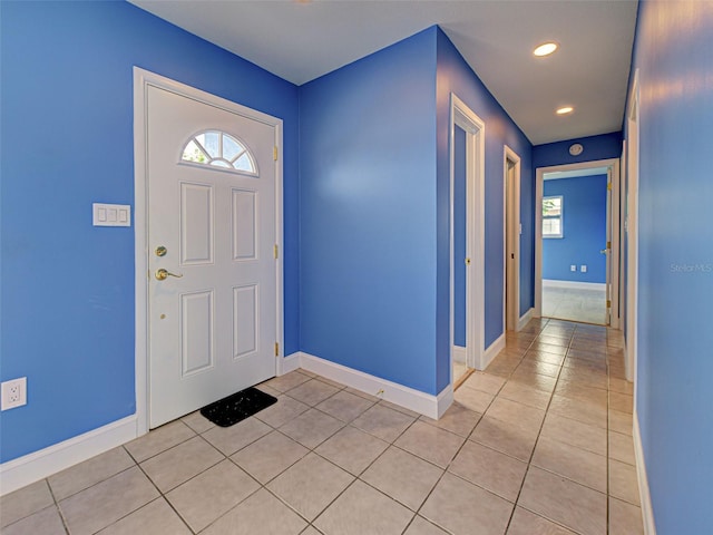1295 S Maryknoll Rd, Englewood, FL 34223 - entryway with light tile patterned floors, healthy amount of natural light, and recessed lighting