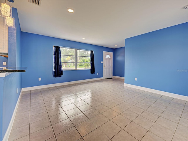 1295 S Maryknoll Rd, Englewood, FL 34223 - unfurnished living room featuring light tile patterned floors and recessed lighting