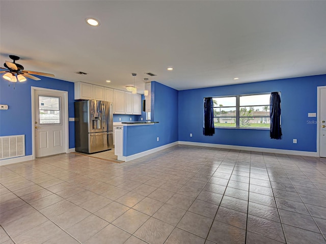 1295 S Maryknoll Rd, Englewood, FL 34223 - unfurnished living room with light tile patterned floors, a ceiling fan, and recessed lighting