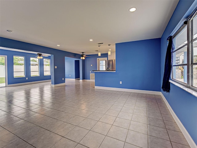 1295 S Maryknoll Rd, Englewood, FL 34223 - tiled empty room with ceiling fan and recessed lighting