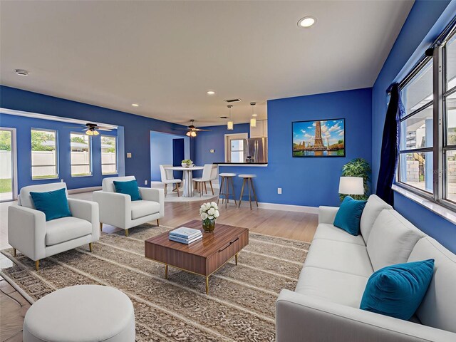 1295 S Maryknoll Rd, Englewood, FL 34223 - living room featuring a ceiling fan, healthy amount of natural light, recessed lighting, and wood finished floors