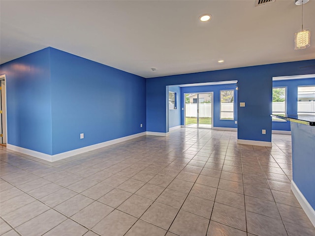 1295 S Maryknoll Rd, Englewood, FL 34223 - tiled empty room with recessed lighting and baseboards
