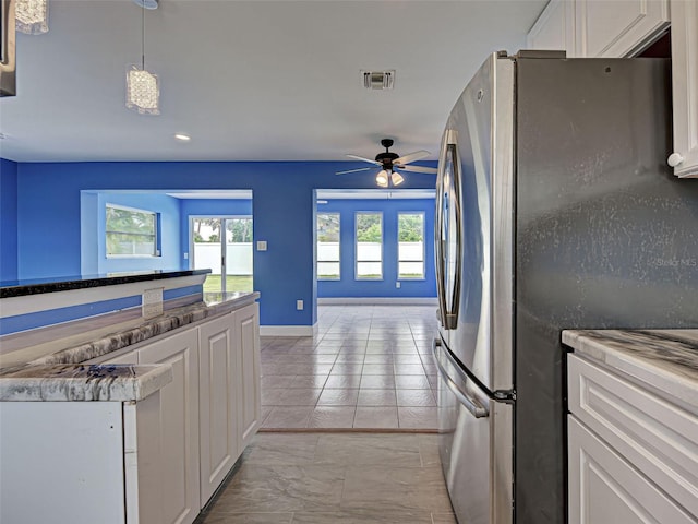 1295 S Maryknoll Rd, Englewood, FL 34223 - kitchen featuring freestanding refrigerator, ceiling fan, white cabinets, recessed lighting, and light marble finish flooring