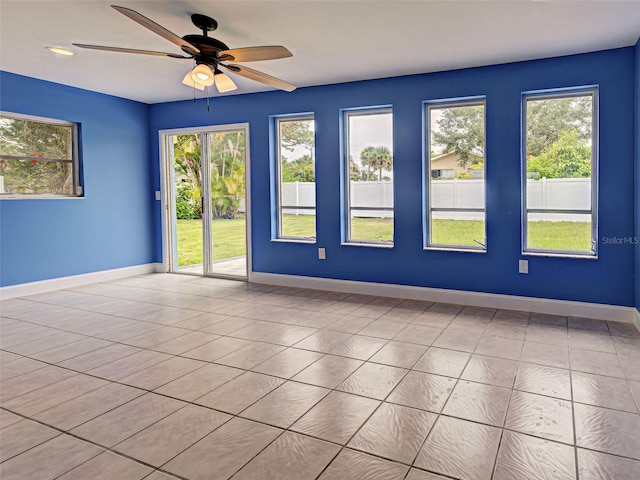 1295 S Maryknoll Rd, Englewood, FL 34223 - spare room with healthy amount of natural light, ceiling fan, and tile patterned flooring