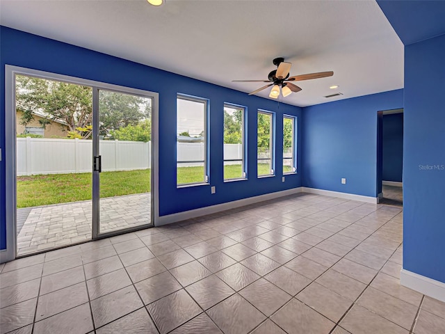 1295 S Maryknoll Rd, Englewood, FL 34223 - tiled empty room with ceiling fan and recessed lighting