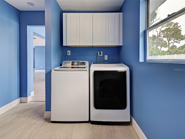 1295 S Maryknoll Rd, Englewood, FL 34223 - laundry area featuring cabinet space and separate washer and dryer