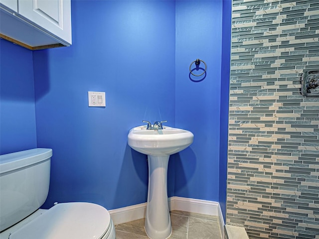1295 S Maryknoll Rd, Englewood, FL 34223 - bathroom featuring toilet and baseboards