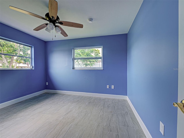 1295 S Maryknoll Rd, Englewood, FL 34223 - unfurnished room featuring a smoke detector, healthy amount of natural light, and ceiling fan