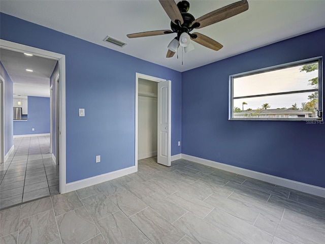 1295 S Maryknoll Rd, Englewood, FL 34223 - unfurnished bedroom featuring ceiling fan and a closet