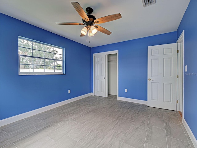 1295 S Maryknoll Rd, Englewood, FL 34223 - unfurnished bedroom featuring a closet and a ceiling fan