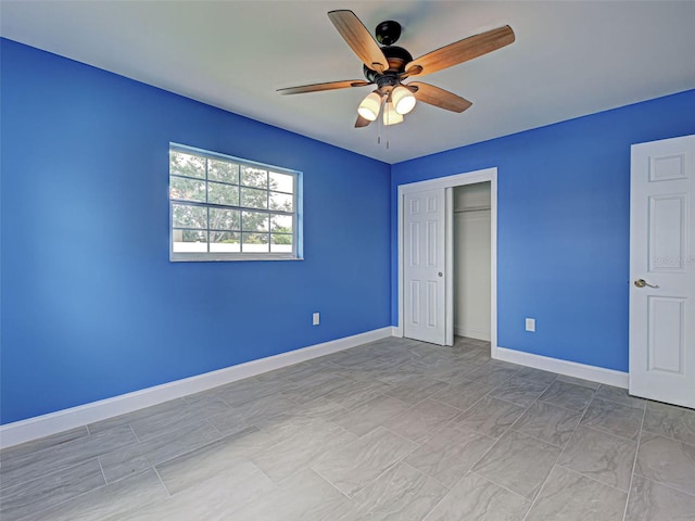 1295 S Maryknoll Rd, Englewood, FL 34223 - unfurnished bedroom with a closet and a ceiling fan