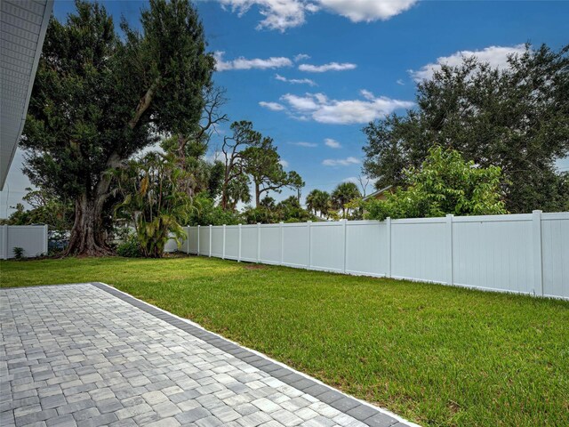 1295 S Maryknoll Rd, Englewood, FL 34223 - fenced backyard featuring a patio