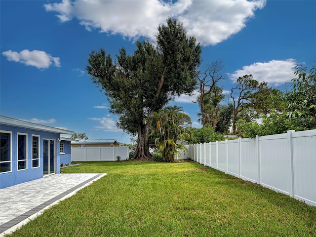 1295 S Maryknoll Rd, Englewood, FL 34223 - fenced backyard with a patio