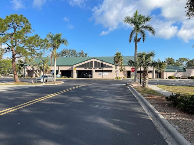 1295 S Maryknoll Rd, Englewood, FL 34223 - view of asphalt road with traffic signs and curbs