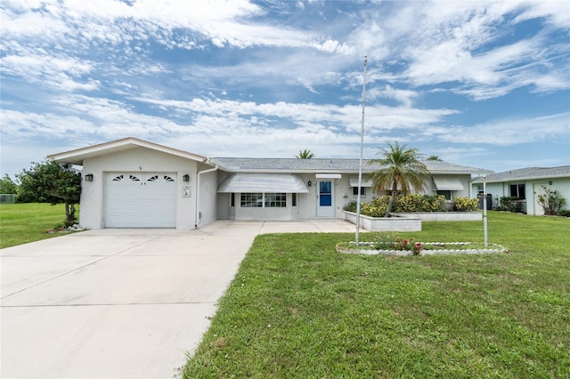 39 Caddy Rd, Rotonda West, FL 33947 - ranch-style home with stucco siding, a front lawn, a garage, and driveway