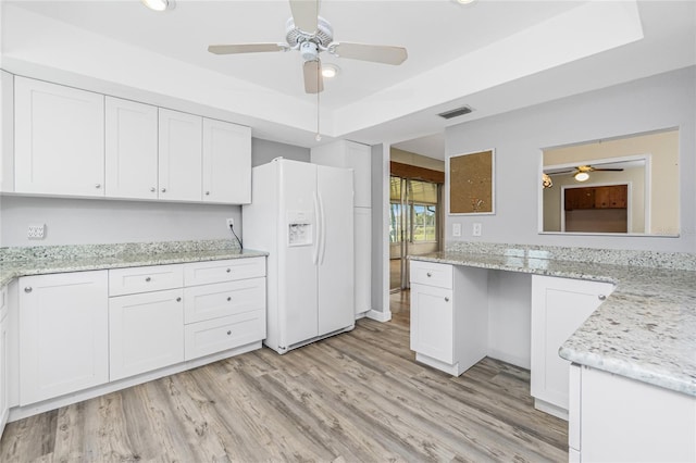 39 Caddy Rd, Rotonda West, FL 33947 - kitchen featuring white fridge with ice dispenser, a ceiling fan, white cabinetry, and recessed lighting