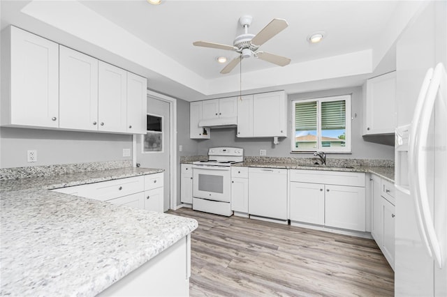 39 Caddy Rd, Rotonda West, FL 33947 - kitchen featuring white appliances, under cabinet range hood, ceiling fan, recessed lighting, and light wood-style floors