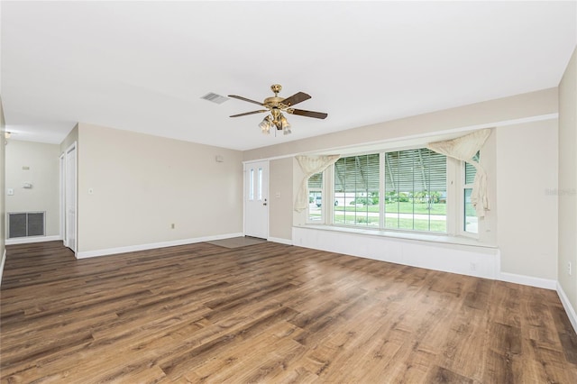 39 Caddy Rd, Rotonda West, FL 33947 - unfurnished living room with wood finished floors and a ceiling fan