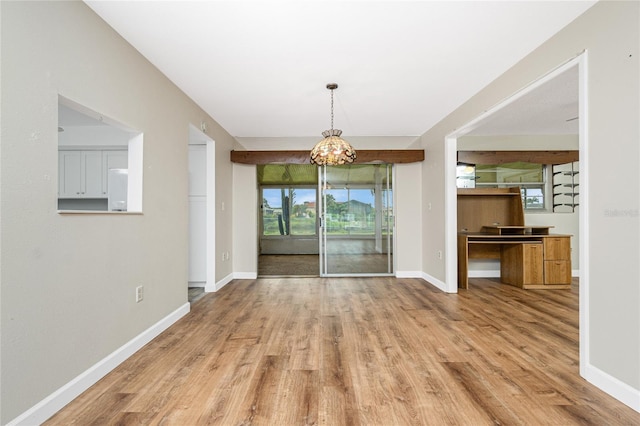 39 Caddy Rd, Rotonda West, FL 33947 - unfurnished dining area with wood finished floors and a chandelier