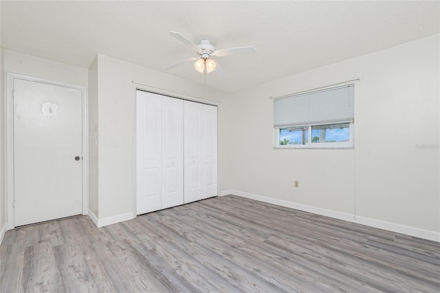 39 Caddy Rd, Rotonda West, FL 33947 - unfurnished bedroom featuring light wood finished floors, a closet, and ceiling fan