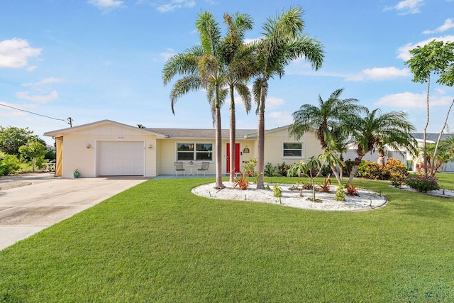 1030 Haste Ln, Englewood, FL 34223 - ranch-style home with concrete driveway, an attached garage, and a front lawn