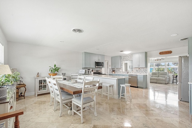 1030 Haste Ln, Englewood, FL 34223 - dining area featuring baseboards