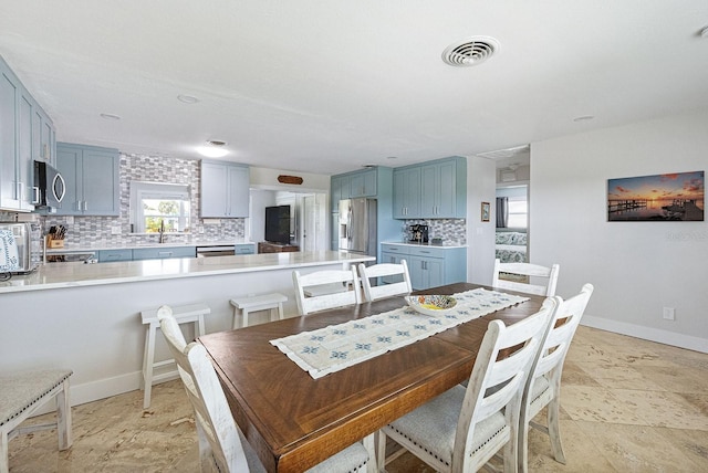 1030 Haste Ln, Englewood, FL 34223 - dining room featuring baseboards