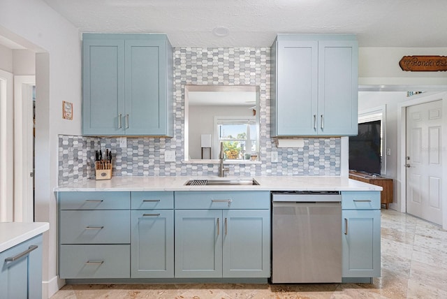1030 Haste Ln, Englewood, FL 34223 - kitchen featuring stainless steel dishwasher, decorative backsplash, and light countertops