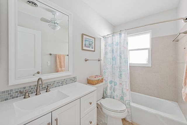 1030 Haste Ln, Englewood, FL 34223 - bathroom featuring vanity, shower / bathtub combination with curtain, ceiling fan, and decorative backsplash